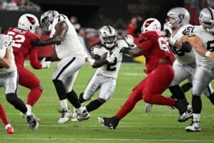 Ashton Jeanty #2 of the Las Vegas Raiders runs with the ball against the Arizona Cardinals during the first quarter of the NFL preseason 2025 game