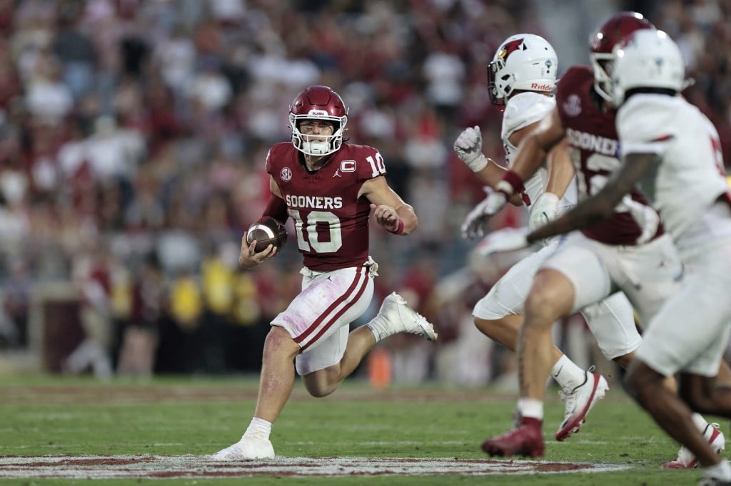 Quarterback John Mateer #10 of the Oklahoma Sooners slows his run as he rolls out against Illinois State Redbirds