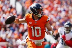 Bo Nix #10 of the Denver Broncos looks to pass the ball during the second quarter against the Tennessee Titans