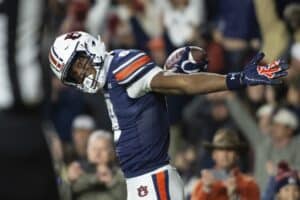 Cam Coleman #8 of the Auburn Tigers celebrates after scoring a touchdown during the first half of their game against the Texas A&M Aggies