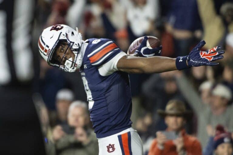 Cam Coleman #8 of the Auburn Tigers celebrates after scoring a touchdown during the first half of their game against the Texas A&M Aggies
