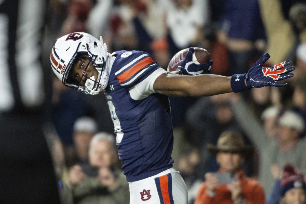 Cam Coleman #8 of the Auburn Tigers celebrates after scoring a touchdown during the first half of their game against the Texas A&M Aggies