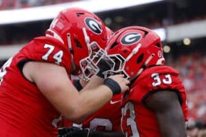 Chauncey Bowens #33 of the Georgia Bulldogs reacts with Drew Bobo #74 after a touchdown.