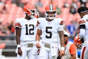 Dillon Gabriel #5 and Shedeur Sanders #12 of the Cleveland Browns look on prior to a game against the Los Angeles Rams