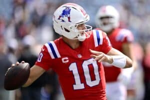 Drake Maye #10 of the New England Patriots warms up before the game against the Pittsburgh Steelers