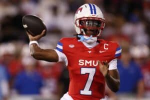 Kevin Jennings #7 of the SMU Mustangs throws a pass against the East Texas A&M Lions.