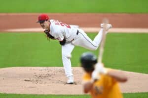 Logan Allen #26 of the Cleveland Guardians throws a pitch against the Athletics.