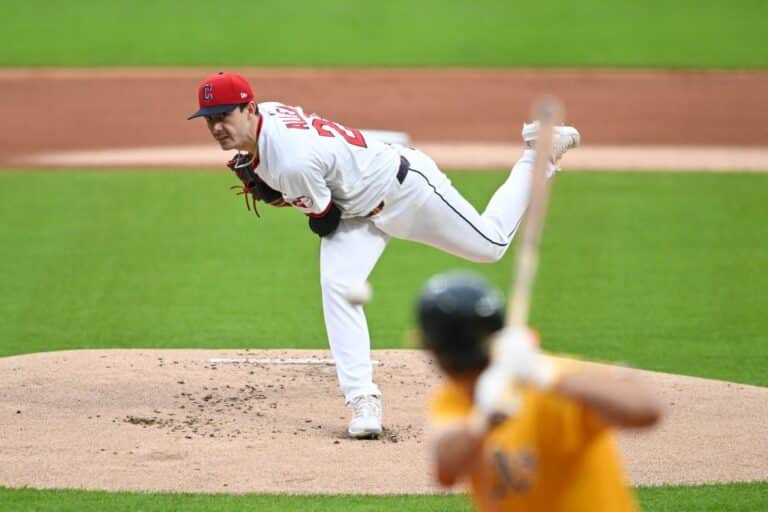 Logan Allen #26 of the Cleveland Guardians throws a pitch against the Athletics.