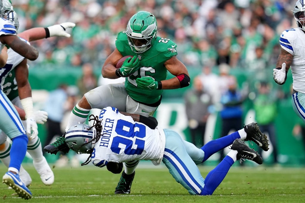 Malik Hooker #28 of the Dallas Cowboys tackles Saquon Barkley #26 of the Philadelphia Eagles.