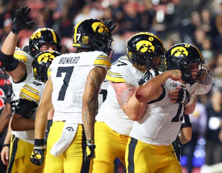 Mark Gronowski #11 of the Iowa Hawkeyes celebrates his touchdown against the Rutgers Scarlet Knights