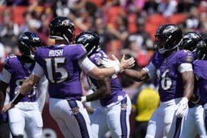 Rasheen Ali and Cooper Rush of the Baltimore Ravens celebrate a touchdown.