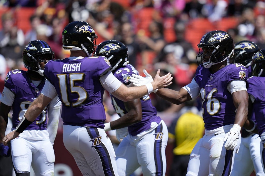 Rasheen Ali and Cooper Rush of the Baltimore Ravens celebrate a touchdown.