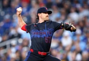 Shane Bieber #57 of the Toronto Blue Jays pitches in the fourth inning during a game against the Milwaukee Brewers.