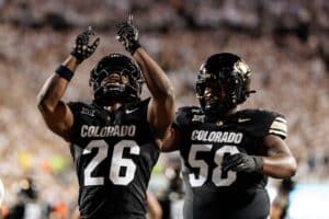 Simeon Price #26 of the Colorado Buffaloes celebrates after scoring a touchdown during the second quarter against the Wyoming Cowboys