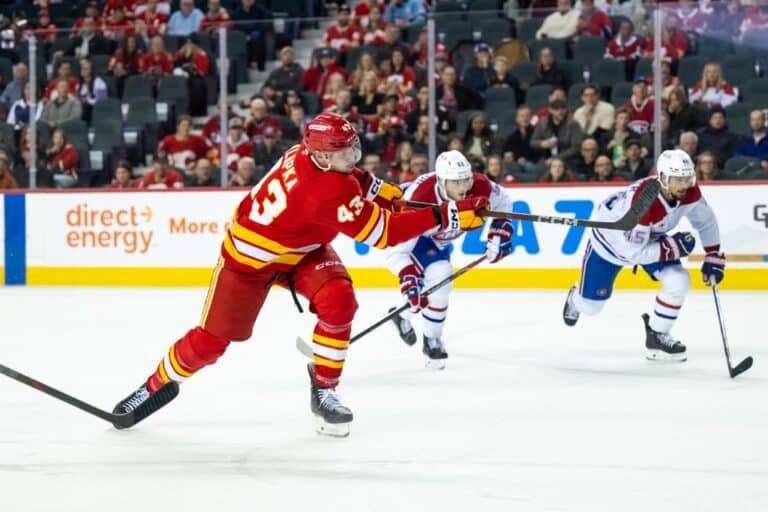 Adam Klapka #43 of the Calgary Flames scores on the Montréal Canadiens