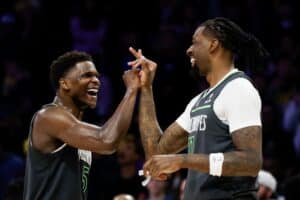 Anthony Edwards #5 and Naz Reid #11 of the Minnesota Timberwolves celebrate