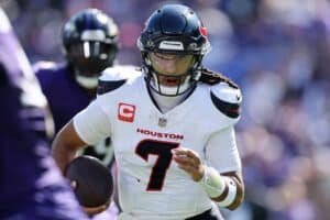 C.J. Stroud #7 of the Houston Texans runs the ball during the second quarter against the Baltimore Ravens
