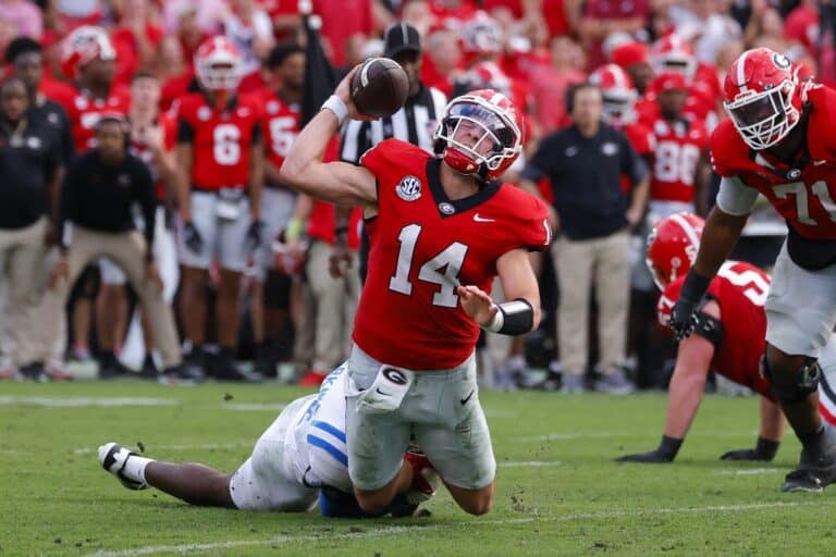 Gunner Stockton #14 of the Georgia Bulldogs is sacked on a two point conversion attempt