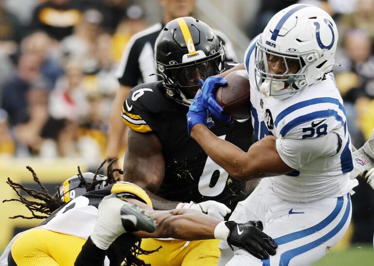 Indianapolis Colts v Pittsburgh Steelers - Oddstrader - Oddstrader The cover for this NFL offensive player of the year article shows Jonathan Taylor #28 of the Indianapolis Colts tackled by Kyle Dugger #29 of the Pittsburgh Steelers and Patrick Queen #6 of the Pittsburgh Steelers.