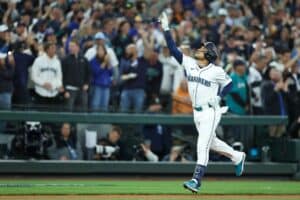 Jorge Polanco #7 of the Seattle Mariners celebrates after hitting a solo home run against the Detroit Tigers
