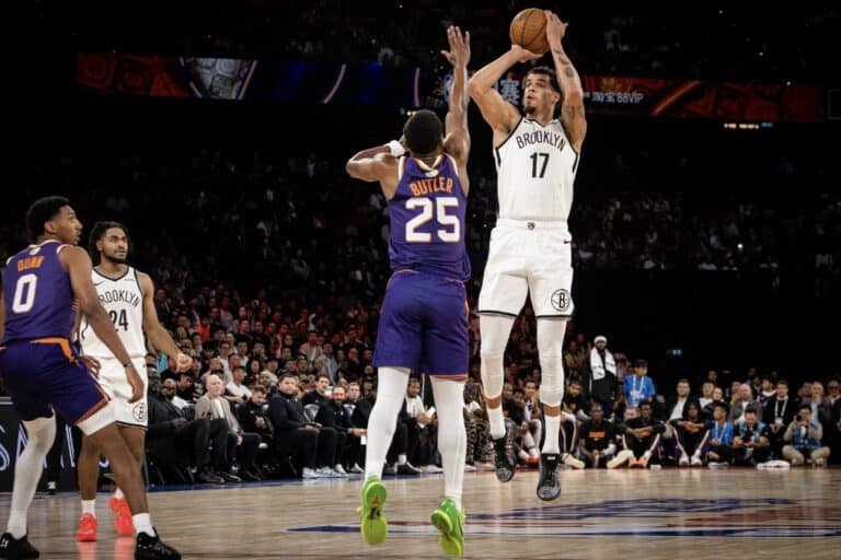 The Brooklyn Nets' Michaerl Porter Jr. #17 (R) shoots during the NBA pre-season basketball game between the Phoenix Suns and the Brooklyn Nets