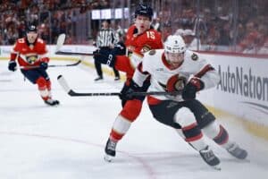 Anton Lundell #15 of the Florida Panthers collides with Nick Jensen #3 of the Ottawa Senators
