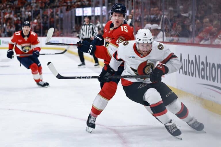Anton Lundell #15 of the Florida Panthers collides with Nick Jensen #3 of the Ottawa Senators