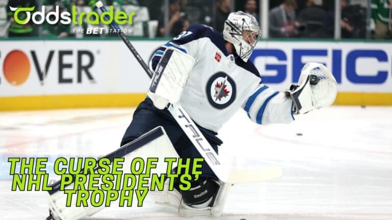 Image of Winnipeg Jets goalie Connor Hellebuyck making a play during a game.