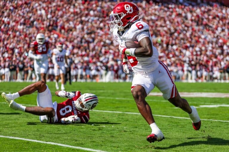 Tory Blaylock #6 of the Oklahoma Sooners runs the ball as Judge Collier #8 of the South Carolina Gamecocks hits the ground