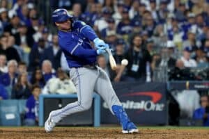 Ty France #2 of the Toronto Blue Jays hits a single during the 10th inning against the Los Angeles Dodgers