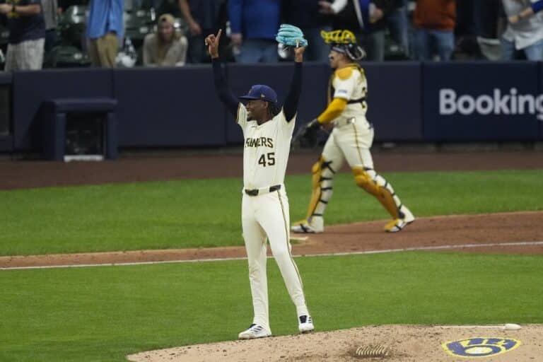 Abner Uribe #45 of the Milwaukee Brewers celebrates the final out to win game five of the National League Division Series against the Chicago Cubs.