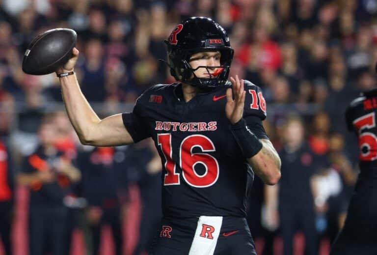 Athan Kaliakmanis #16 of the Rutgers Scarlet Knights throws a pass against the Iowa Hawkeyes.