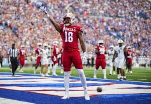 DeShawn Hanika #18 of the Kansas Jayhawks celebrates after scoring a touchdown against the Wagner Seahawks.