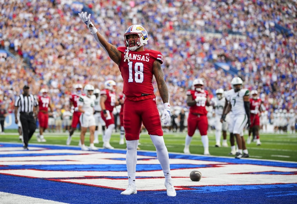 DeShawn Hanika #18 of the Kansas Jayhawks celebrates after scoring a touchdown against the Wagner Seahawks.