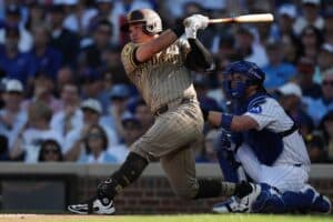 Freddy Fermin #54 of the San Diego Padres hits a single during game one of the National League Wild Card Series against the Chicago Cubs