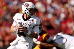 Jacob Clark #12 of the Missouri State Bears looks to pass against the USC Trojans.