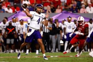 Katin Houser #4 of the East Carolina Pirates drops back to pass during the first half against the NC State Wolfpack