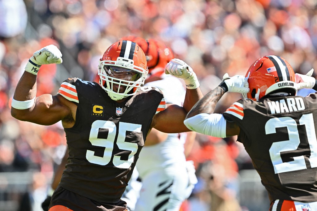 Myles Garrett of the Cleveland Browns, a top contender for NFL Defensive Player of The Year, reacts with Denzel Ward against the Cincinnati Bengals.