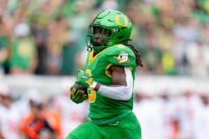 Running back Noah Whittington #6 of the Oregon Ducks carries the ball down the field during a game against the Oklahoma State Cowboys