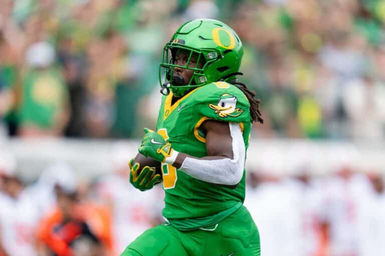Running back Noah Whittington #6 of the Oregon Ducks carries the ball down the field during a game against the Oklahoma State Cowboys