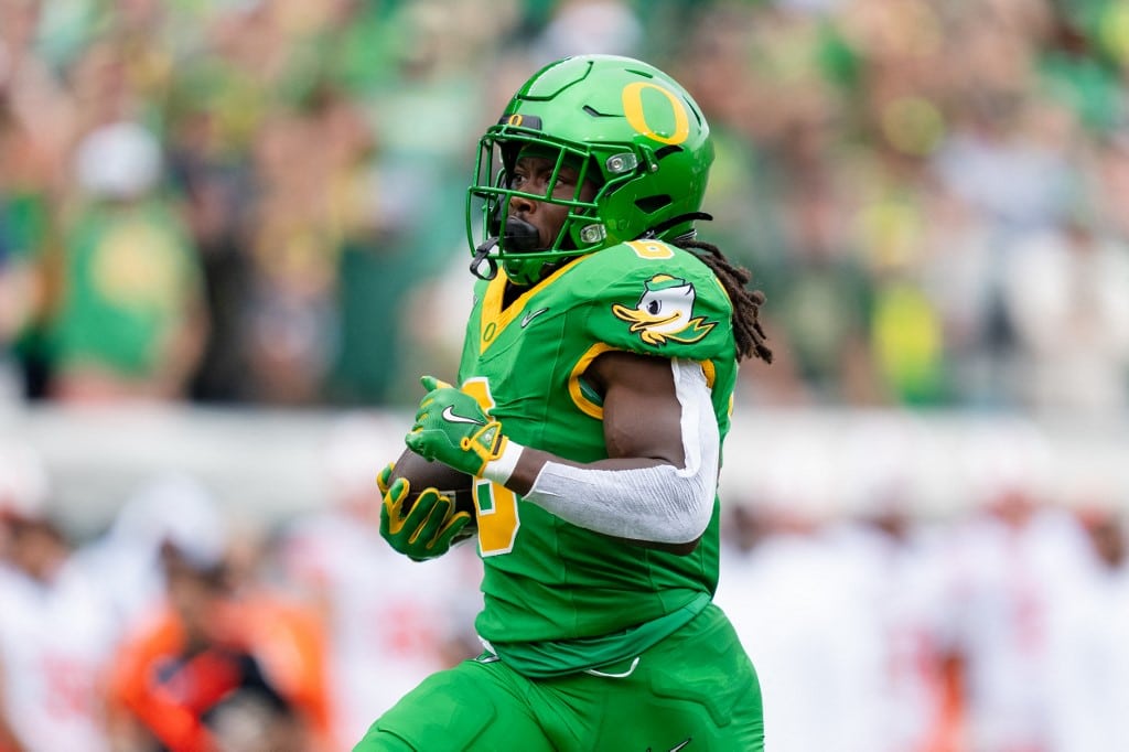 Running back Noah Whittington #6 of the Oregon Ducks carries the ball down the field during a game against the Oklahoma State Cowboys