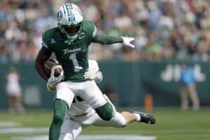 Wide receiver Omari Hayes #1 of the Tulane Green Wave is defended by defensive back Cole Searight #10 of the Army West Point Black Knights.
