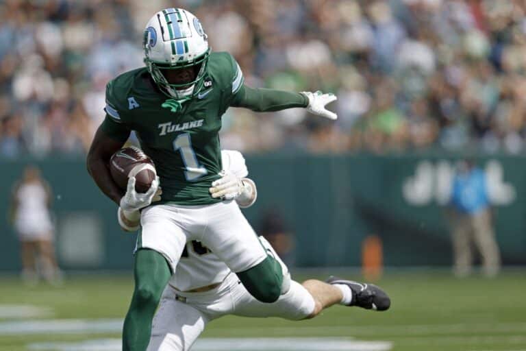 Wide receiver Omari Hayes #1 of the Tulane Green Wave is defended by defensive back Cole Searight #10 of the Army West Point Black Knights.