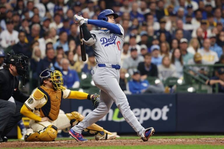 Shohei Ohtani #17 of the Los Angeles Dodgers grounds out during the game against the Milwaukee Brewers.