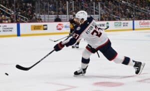 Zachary Aston-Reese #27 of the Columbus Blue Jackets attempts a shot against the Pittsburgh Penguins.