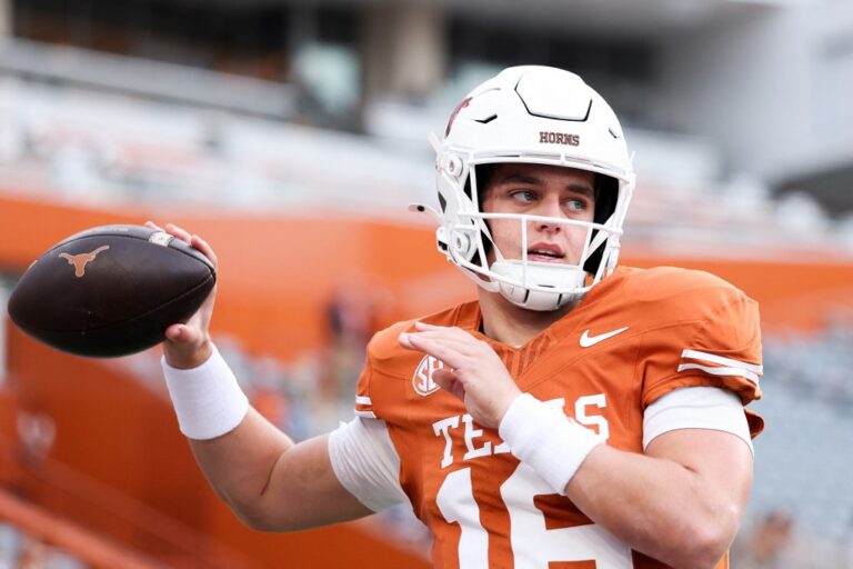 The cover for this College football player props week 13 article shows Arch Manning #16 of the Texas Longhorns warming up prior to the game against the Vanderbilt Commodores.