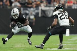 Jacksonville Jaguars v Las Vegas Raiders - Oddstrader The cover for this Monday night football picks article shows Ashton Jeanty #2 of the Las Vegas Raiders runs against Antonio Johnson #26 of the Jacksonville Jaguars