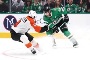 The cover for this NHL picks today article shows Tyler Seguin #91 of the Dallas Stars advancing the puck under pressure from Jamie Drysdale #9 of the Philadelphia Flyers