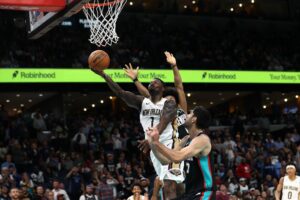 New Orleans Pelicans v Memphis Grizzlies - Oddstrader The cover for this NBA player props today article shows Zion Williamson #1 of the New Orleans Pelicans going to the basket against Santi Aldama #7 of the Memphis Grizzlies.