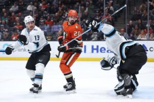 Utah Mammoth v Anaheim Ducks - Oddstrader Chris Kreider #20 of the Anaheim Ducks looks for a deflection as Brandon Tanev #13 and Karel Vejmelka #70 of the Utah Mammoth defend.
